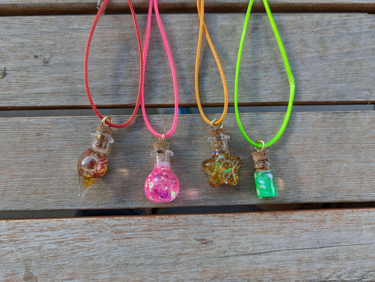 four glitter bottle necklaces, round bottle, cylinder bottle, star bottle, tear drop bottle