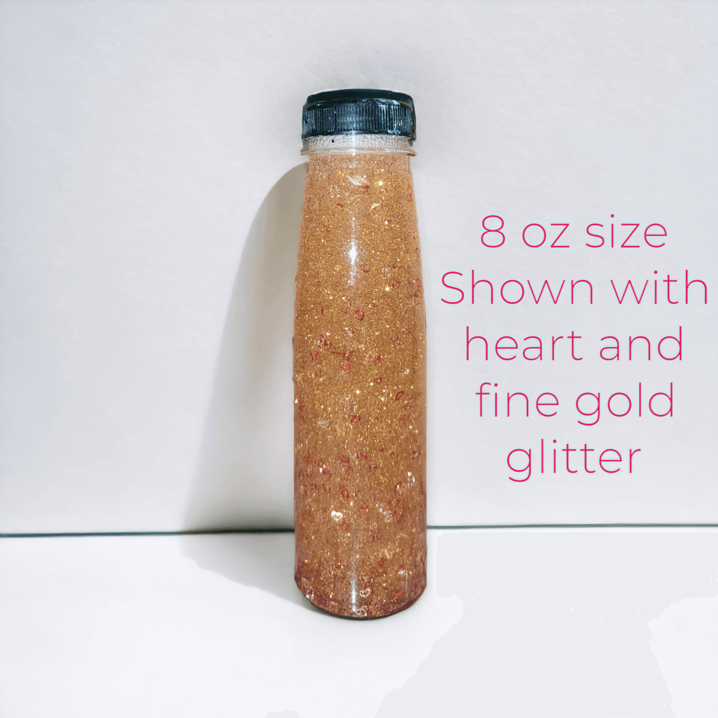 9 oz glitter bottle with gold glitter and heart shapes 
