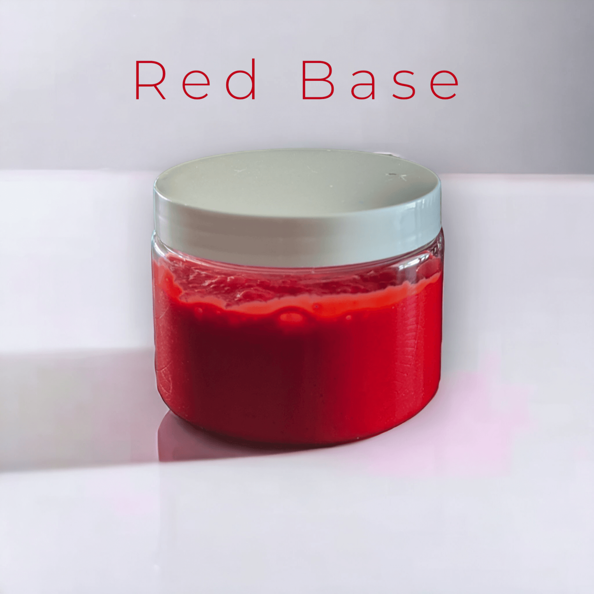 Red slime in a 12 oz jar